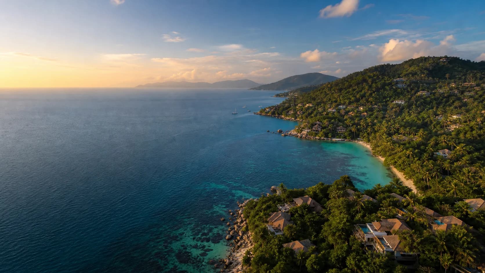 Aerial view of a tropical Koh Samui bay at golden hour
